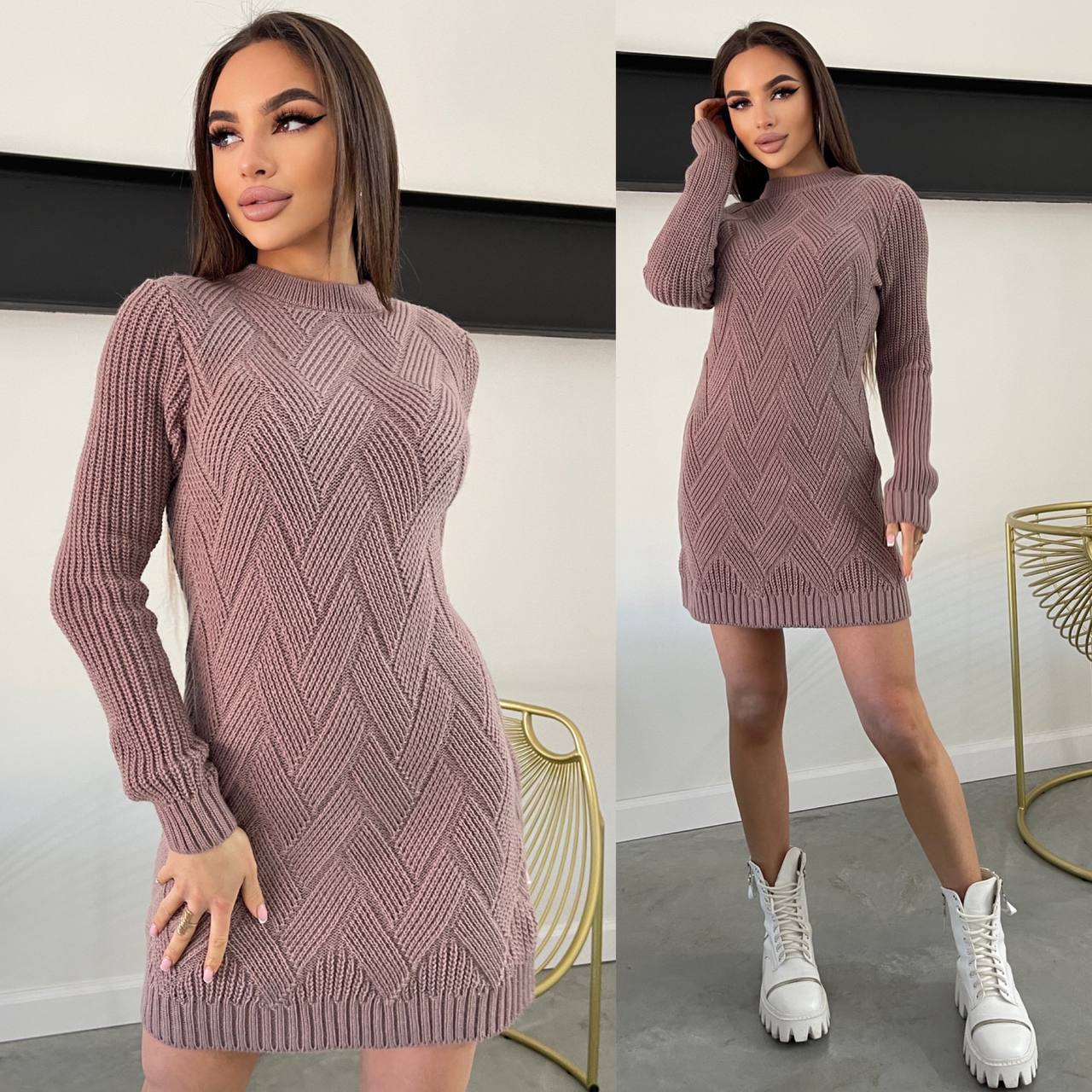 Woman wearing a mauve knitted dress with white sneakers in a minimal indoor setting.