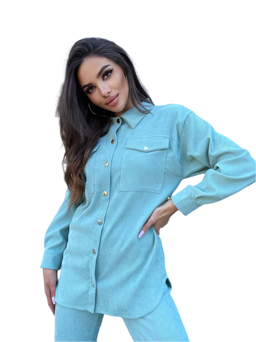 Woman wearing a light blue denim outfit on a white background