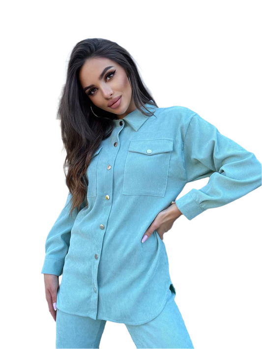 Woman wearing a light blue denim outfit on a white background