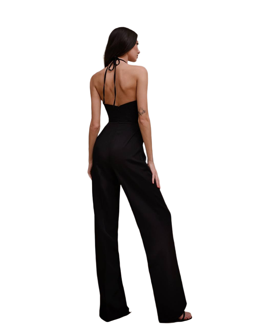 Woman wearing a black jumpsuit on a white background