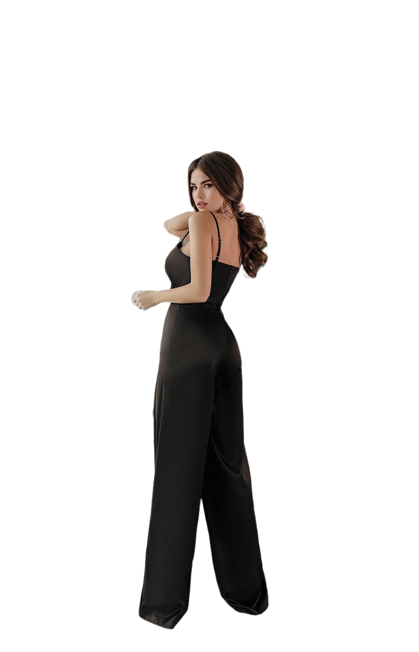 Woman wearing a black jumpsuit on a white background