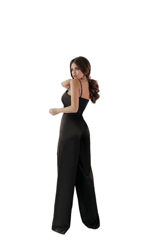 Woman wearing a black jumpsuit on a white background