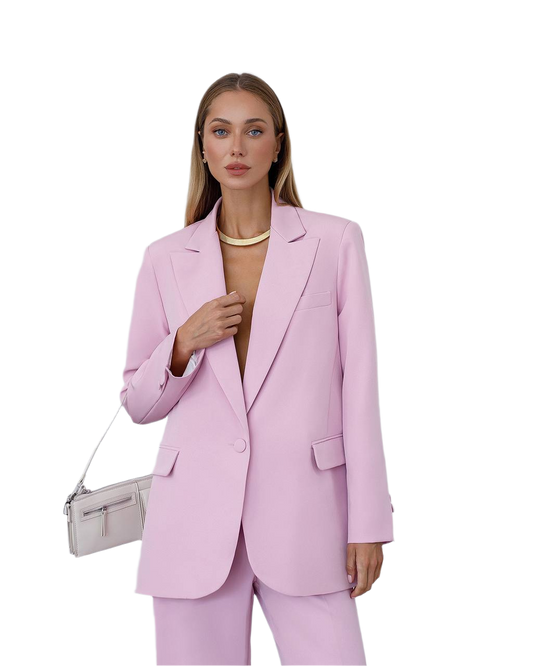 Woman wearing a pink suit with a white background