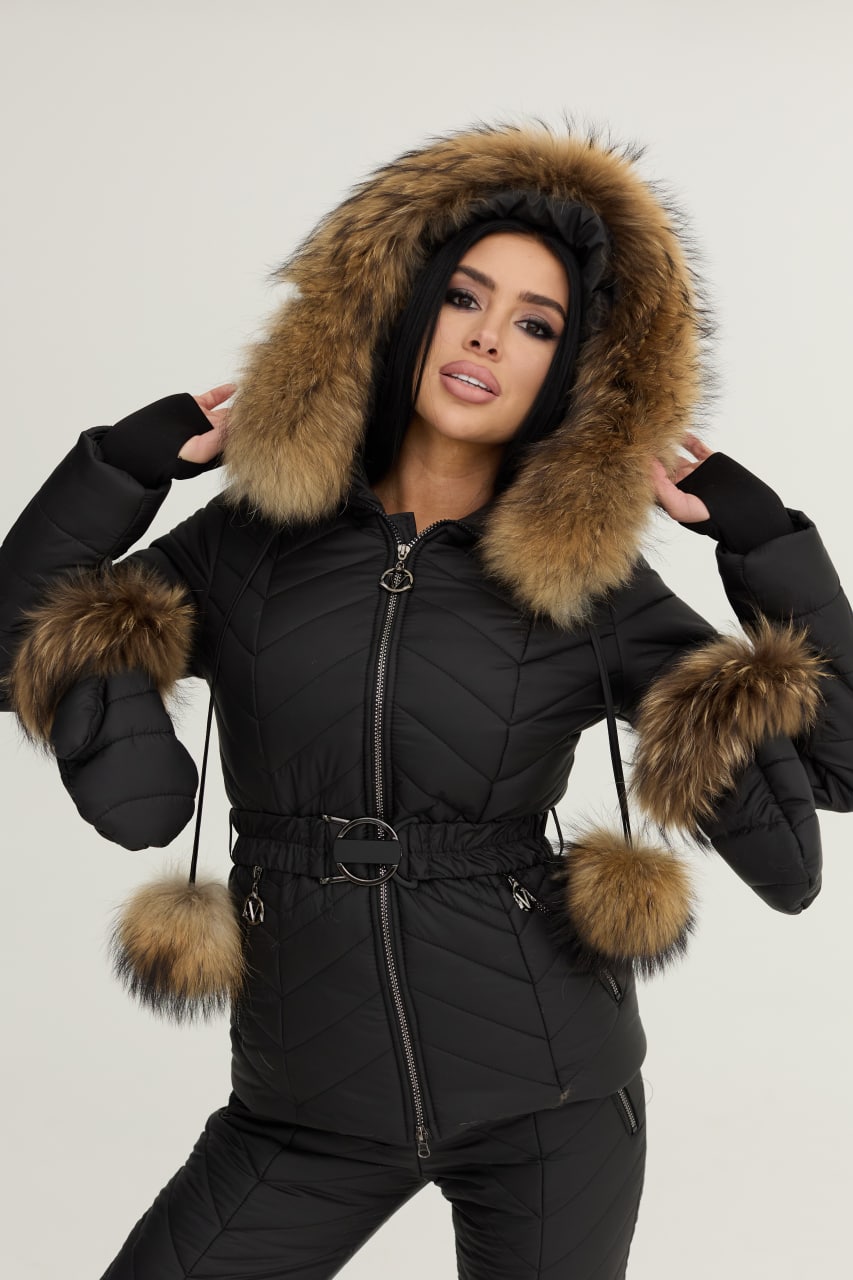 Black winter coat with fur-lined hood and cuffs on a plain background