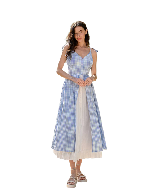 Woman wearing a blue and white checkered dress on a white background