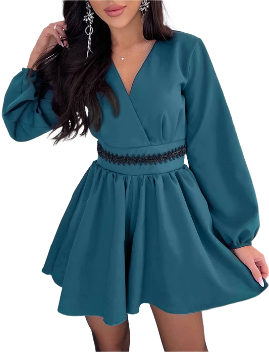Teal dress with long sleeves on a white background