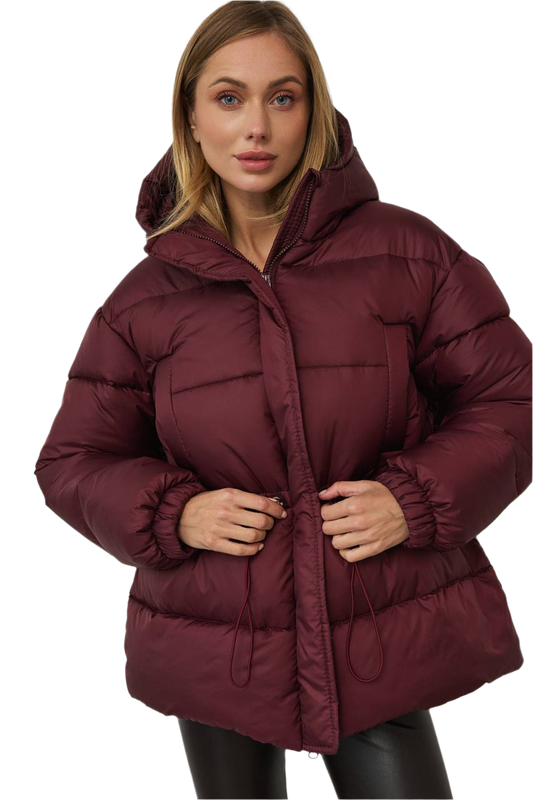 Woman wearing a burgundy puffer jacket on a white background