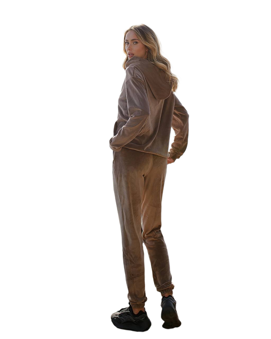 Woman wearing a brown jacket and pants on a white background