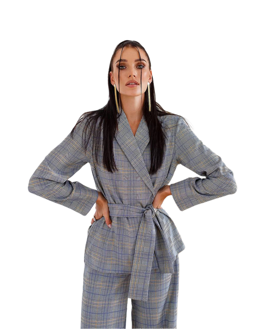 Woman wearing a blue checkered coat and pants on a white background