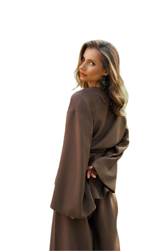 Woman wearing a brown outfit on a white background
