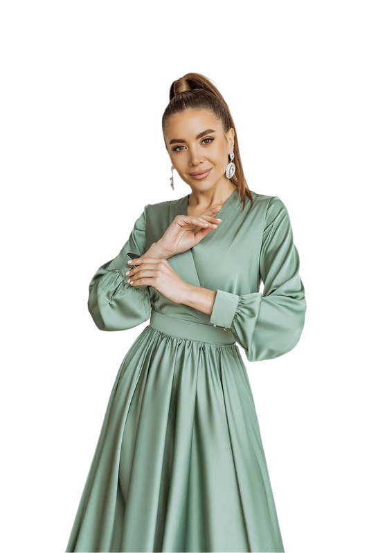 Woman wearing a green dress on a white background