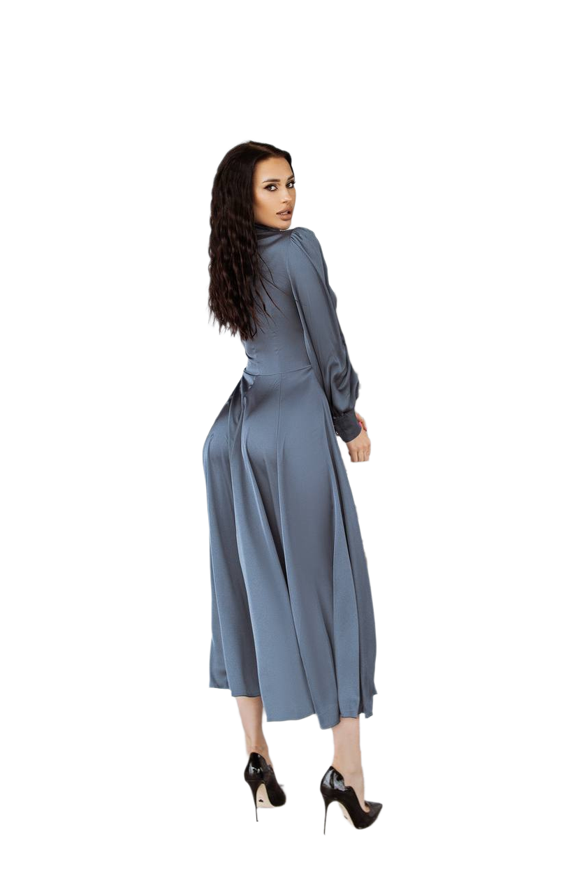 Woman wearing a long blue dress on a white background