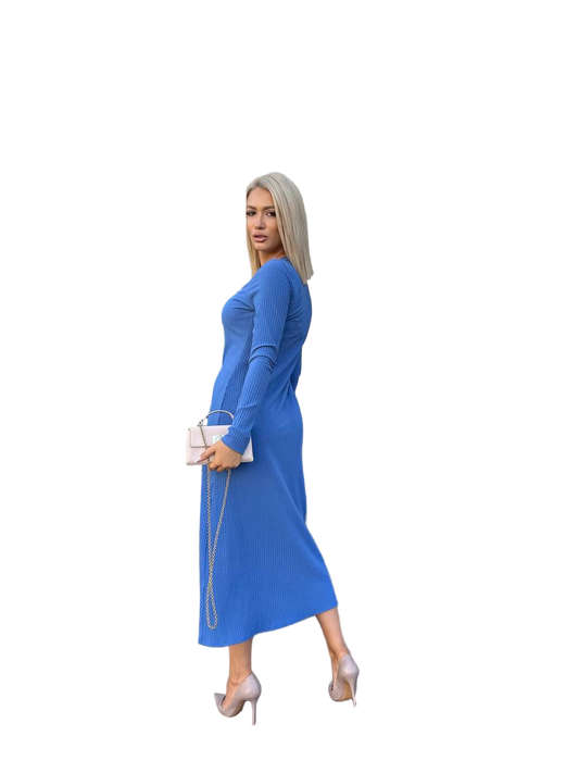 Woman wearing a blue dress holding a clutch on a white background