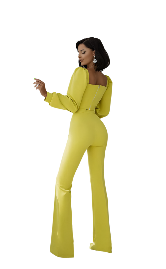 Woman wearing a bright yellow jumpsuit on a white background