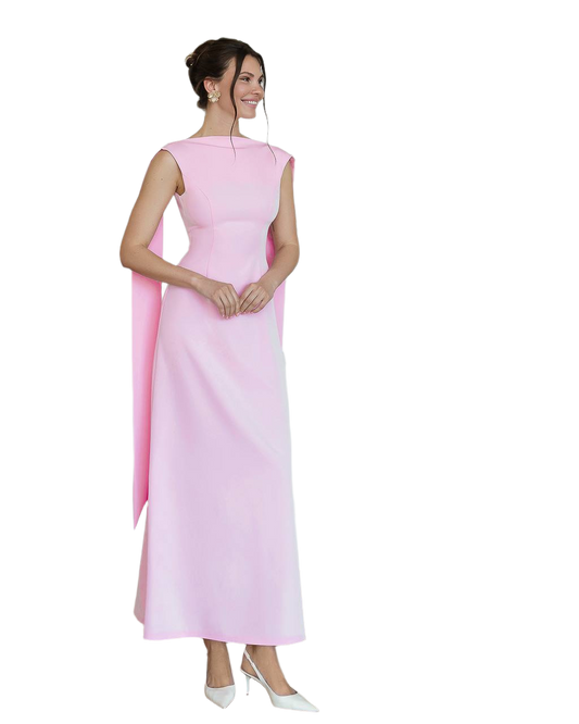 Woman wearing a pink evening gown on a white background