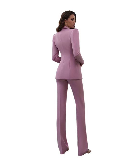 Woman wearing a pink suit on a white background