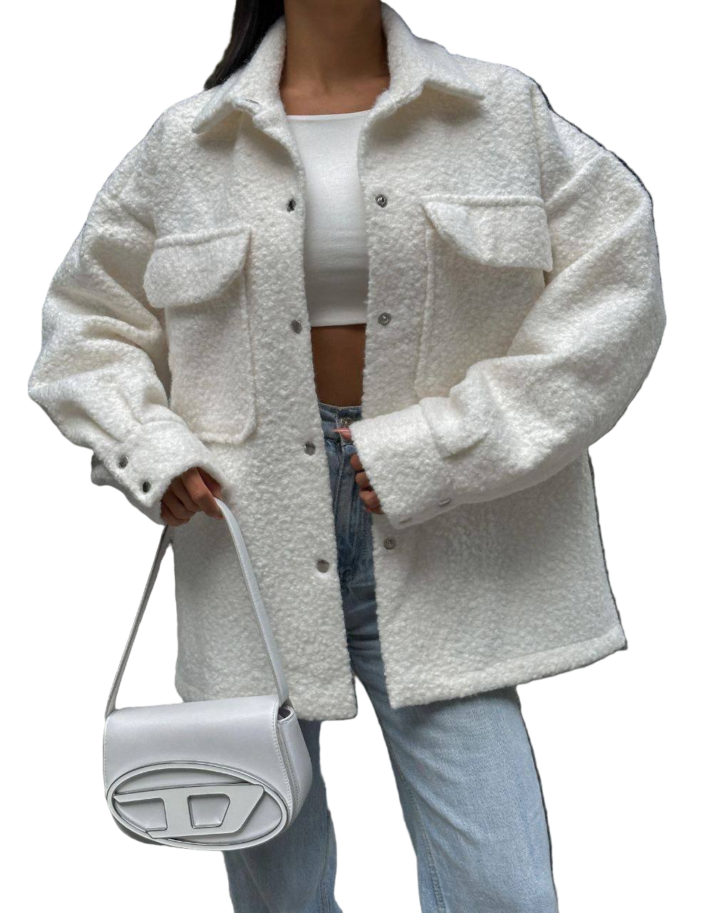 Person wearing a white textured jacket holding a white handbag on a white background