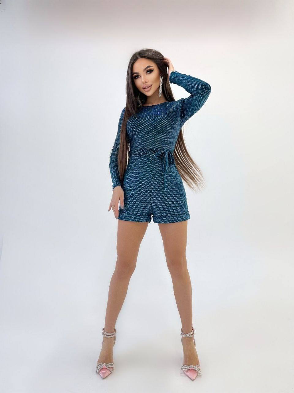 Woman wearing a blue outfit with a white background