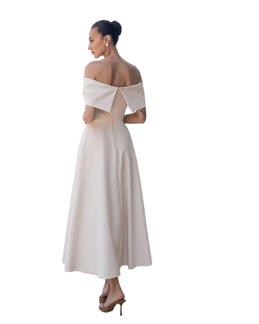 Woman wearing a white off-shoulder dress on a white background