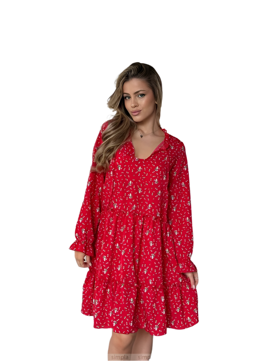 Woman wearing a red dress with a floral pattern on a white background