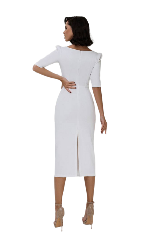 Woman wearing a white dress with a slit on a white background