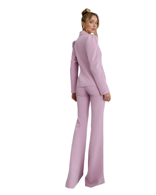 Woman wearing a pink suit on a white background
