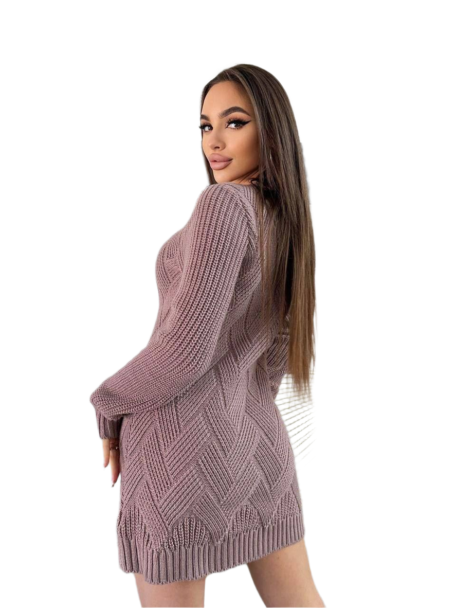 Woman wearing a pink knitted dress on a white background