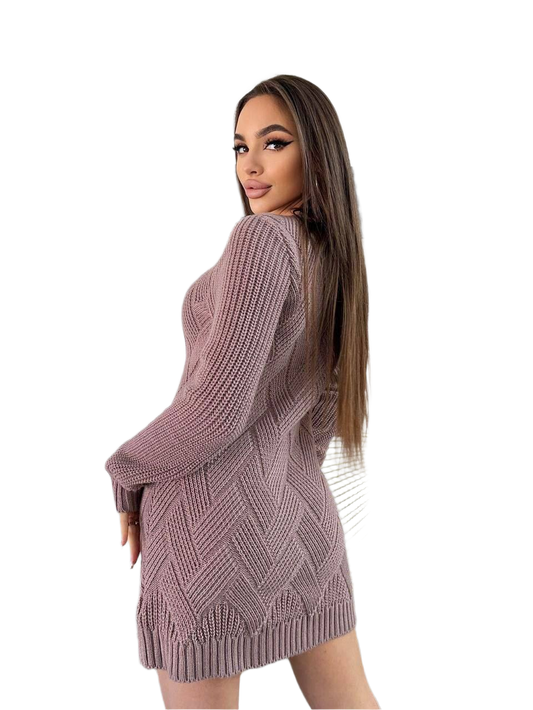 Woman wearing a pink knitted dress on a white background