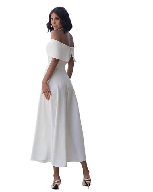 Woman wearing a white off-shoulder dress on a white background