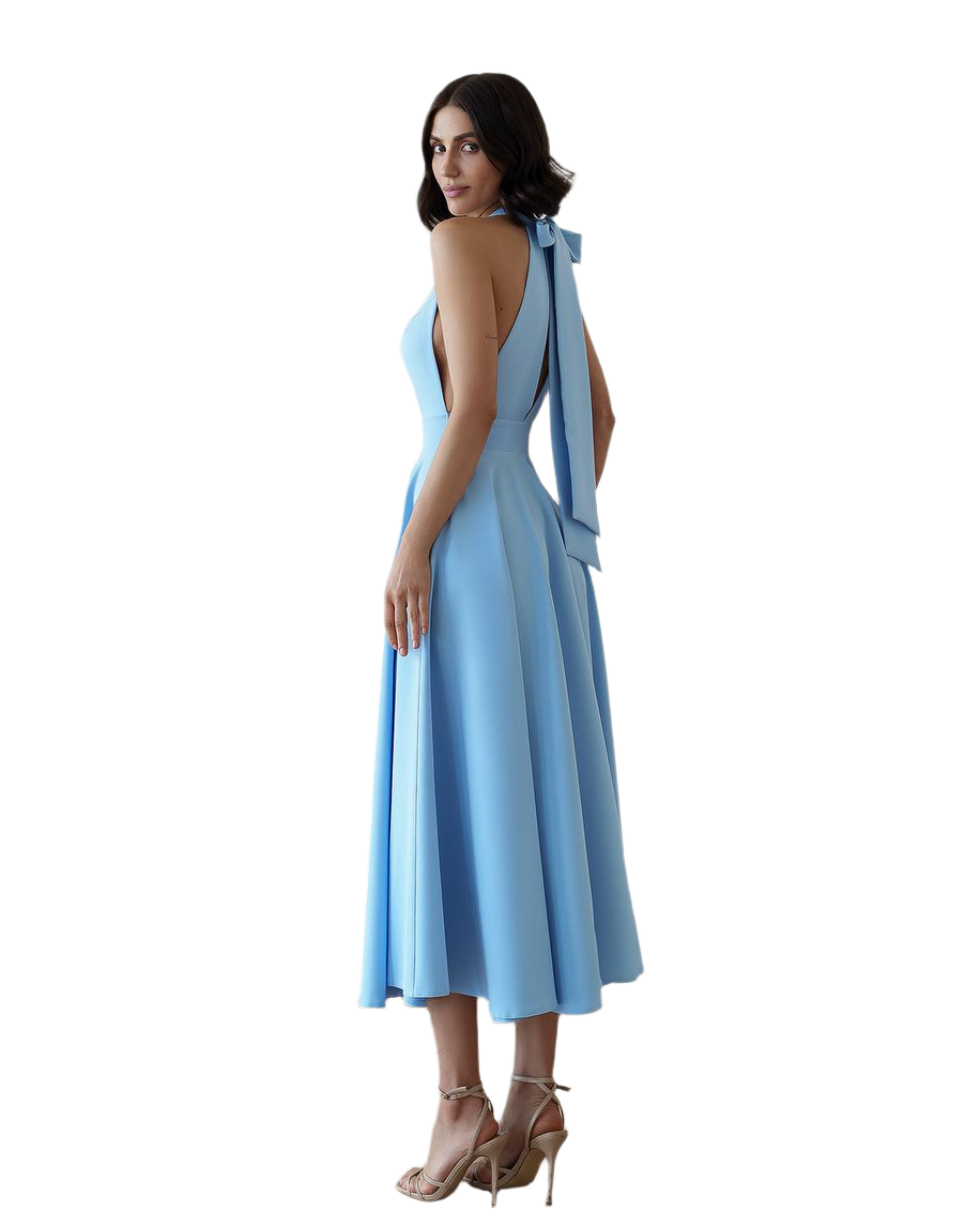 Woman wearing a light blue dress with a plunging neckline and shoulder straps on a white background