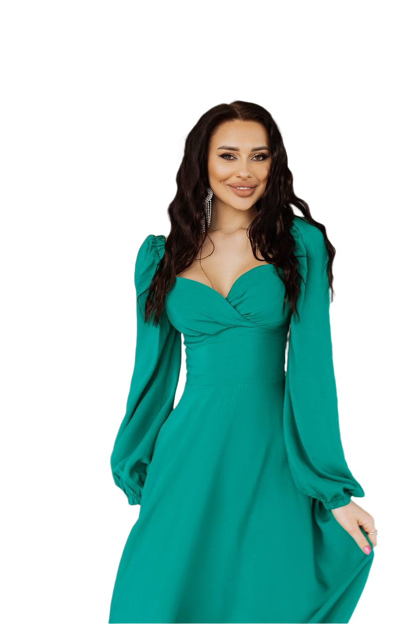 Woman wearing a teal dress with long sleeves on a white background