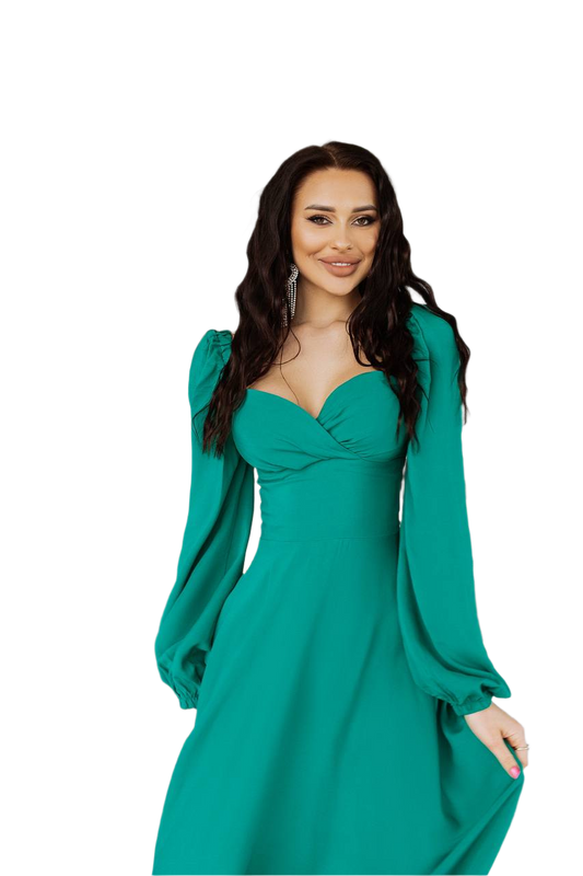 Woman wearing a teal dress with long sleeves on a white background