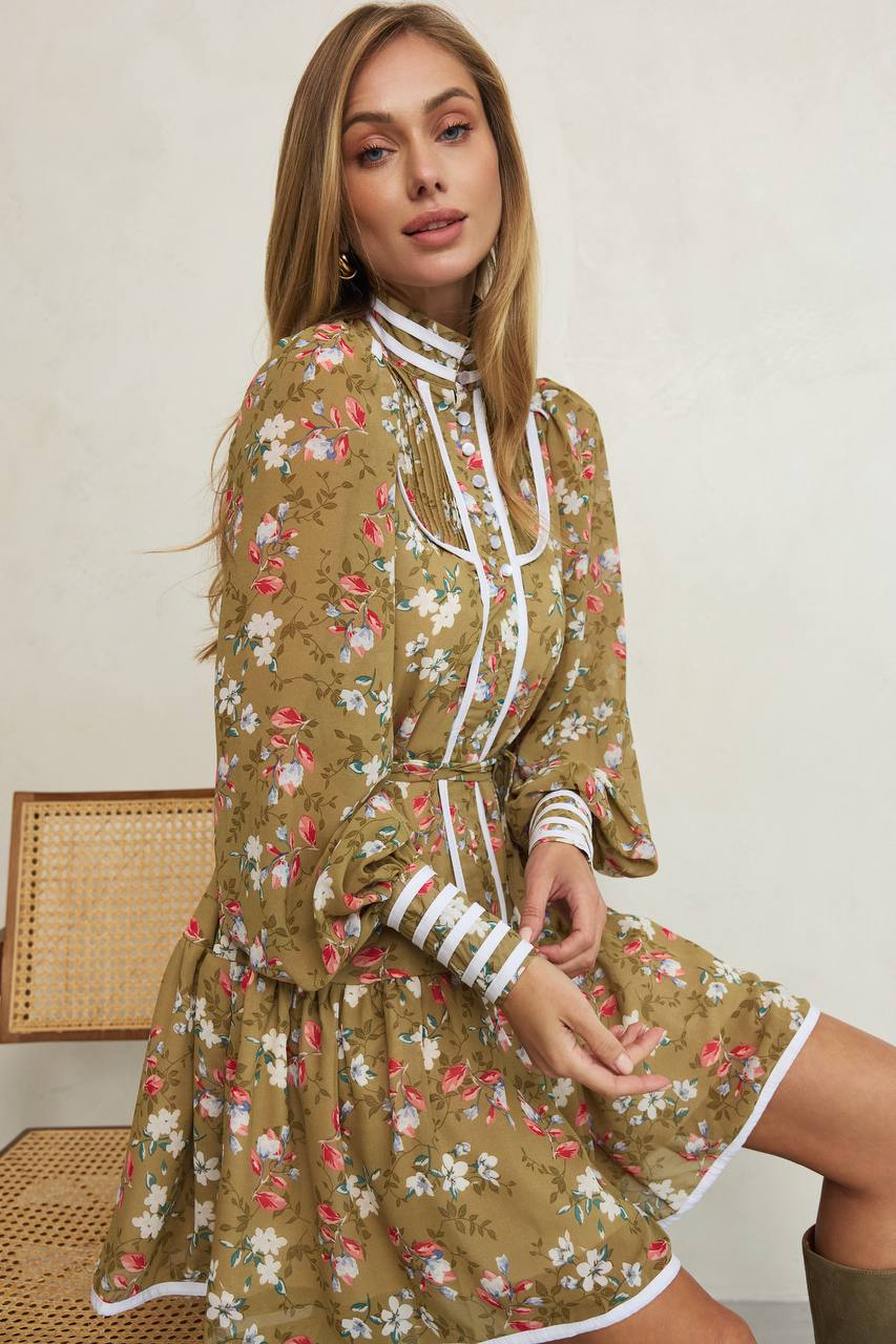 Woman wearing a floral dress with a white background