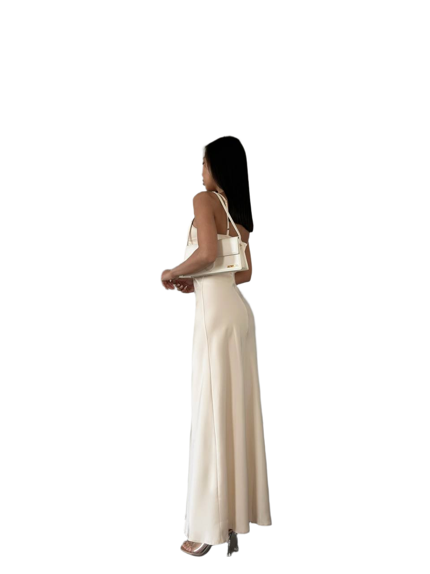 Woman wearing a beige dress on a white background