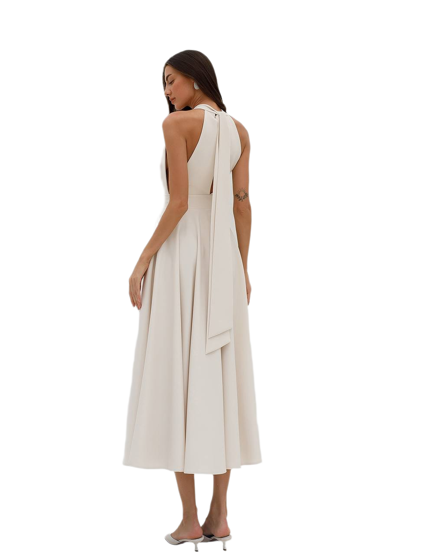 Woman wearing a white dress with a flowing design on a white background