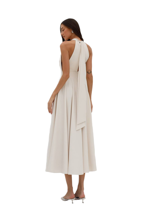 Woman wearing a white dress with a flowing design on a white background