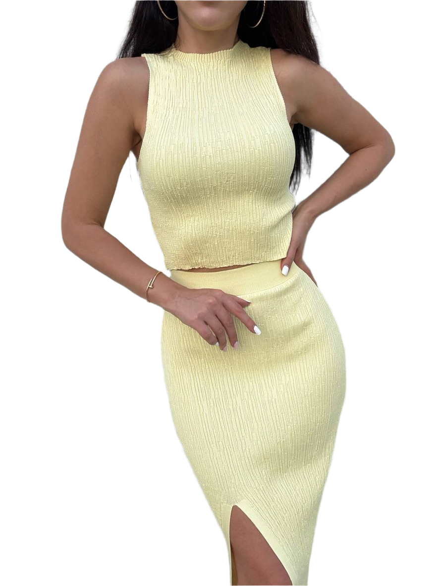 Light yellow ribbed dress with a slit on a white background