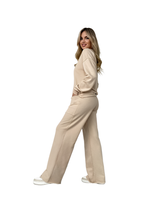 Woman wearing a beige suit on a white background