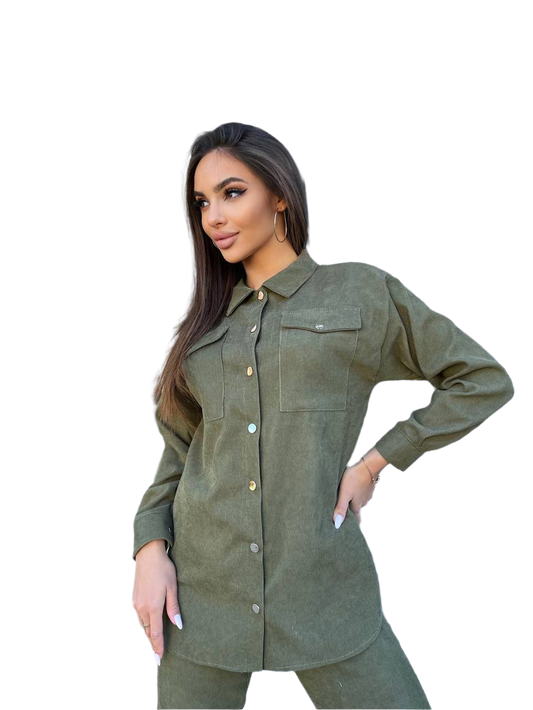 Woman wearing a green jacket and pants on a white background