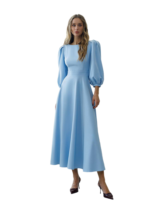 Woman wearing a light blue dress with puffed sleeves on a white background