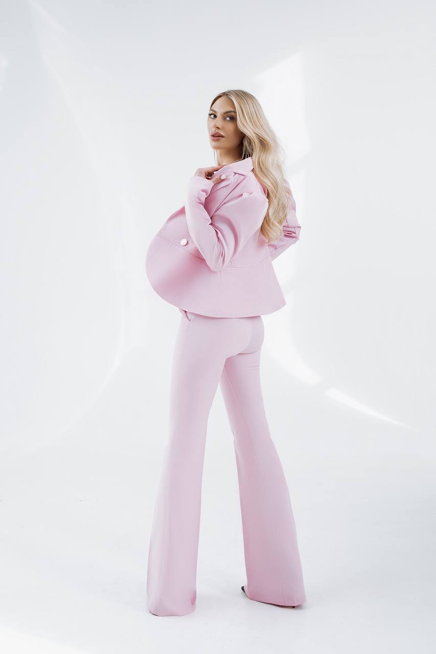 Woman wearing a pink outfit on a white background