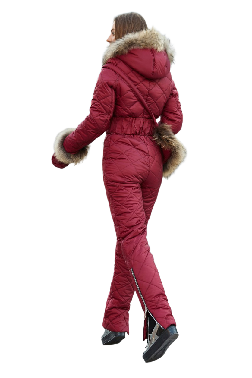Person wearing a red snowsuit with fur trim on a white background