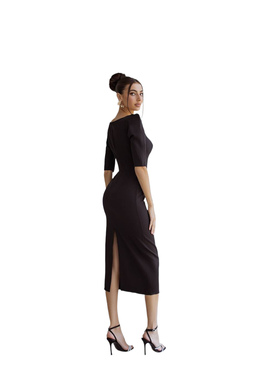 Woman wearing a black dress with a slit on a white background