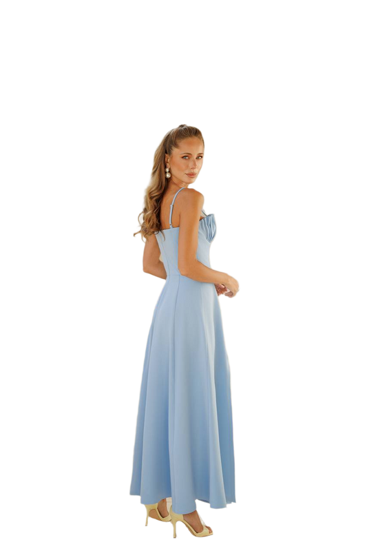 Woman wearing a light blue dress on a white background