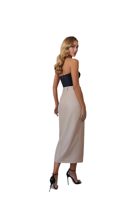 Woman wearing a strapless black top and beige skirt on a white background