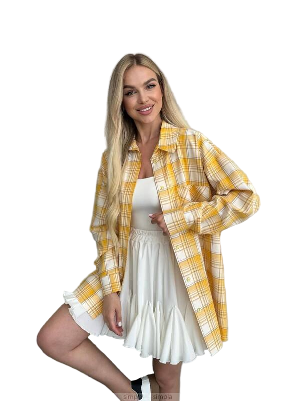 Woman wearing a yellow plaid shirt over a white dress on a white background