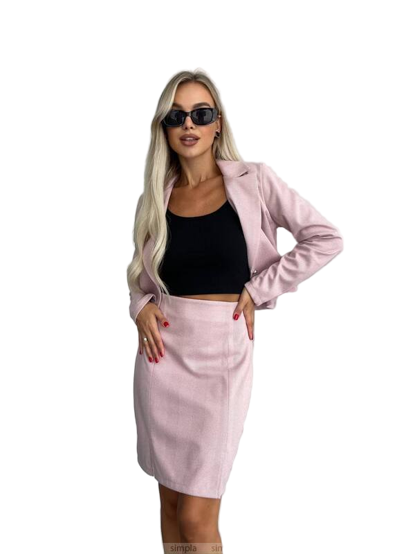 Woman wearing a pink blazer and skirt set with sunglasses on a white background
