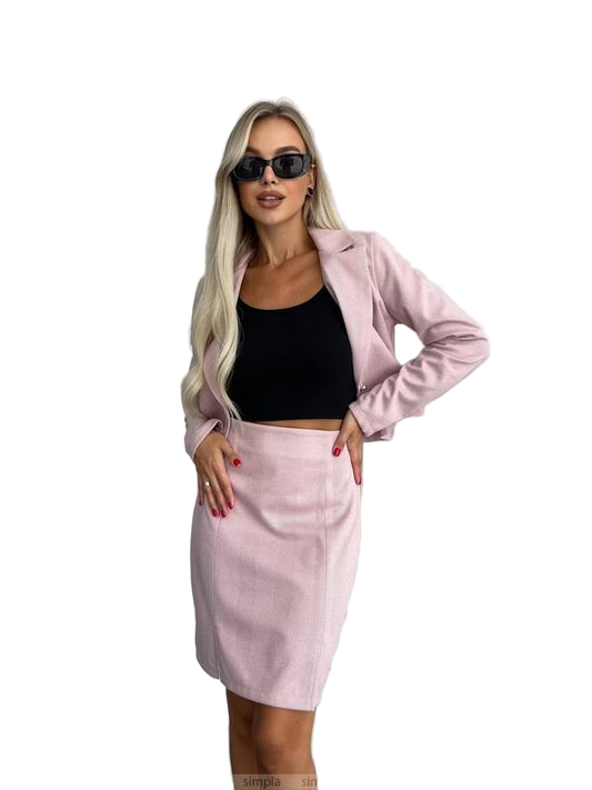 Woman wearing a pink blazer and skirt set with sunglasses on a white background
