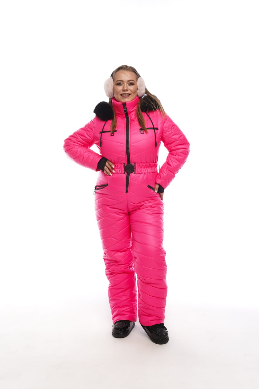 Person wearing a bright pink snowsuit with black accents on a white background