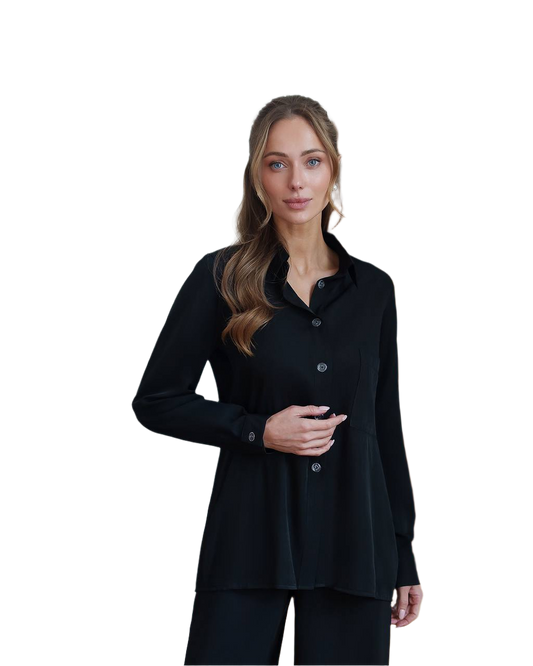 Woman wearing a black long-sleeve shirt on a white background